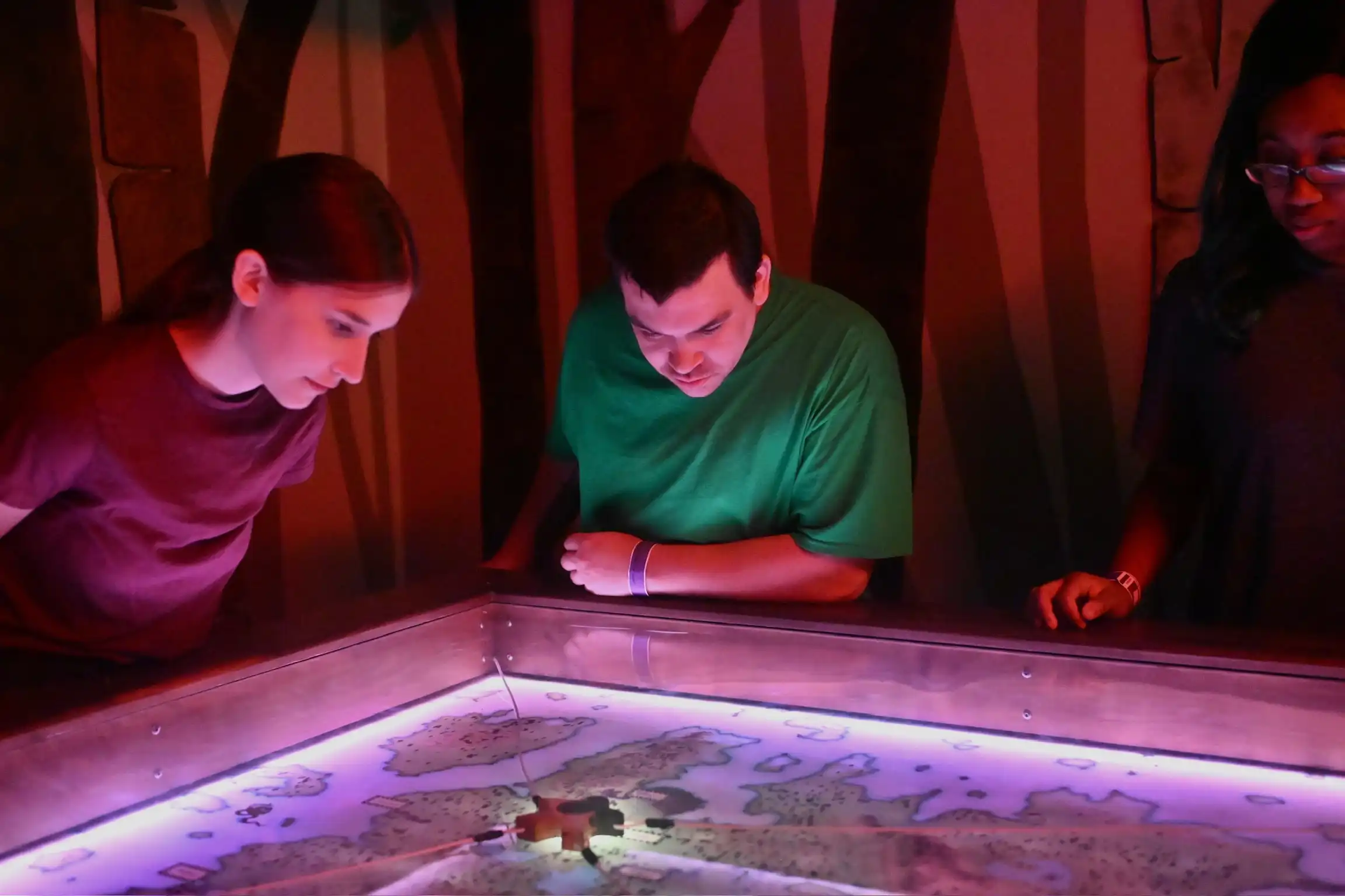 Three people looking at a map